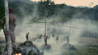 In the film within a film, the production's biggest scene depicts the natives of the New World burned on crosses by 15th century Spaniards in "Even the Rain."