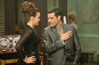 Carla Gugino as Madam Gorski and Oscar Isaac as Blue Jones in "Sucker Punch."