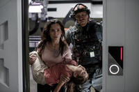 Alice Braga as Throws Frey, Emma Tremblay as Matilda and Josh Blacker as Crowe in "Elysium."
