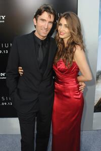 Sharlto Copley and guest at the California premiere of "Elysium."