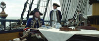 Geoffrey Rush as Captain Barbossa and Greg Ellis as Groves in "Pirates Of The Caribbean: On Stranger Tides."