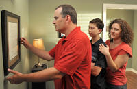 Alex Kendrick as Adam Mitchell, Rusty Martin as Dylan and Renee Jewell as Victoria in "Courageous."