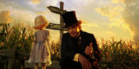 China Girl voiced by Joey King and James Franco as Oscar Diggs in "Oz: The Great and Powerful."