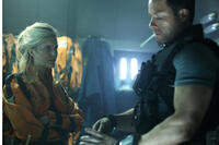 Maggie Grace as Emilie Warnock and Guy Pearce as Snow in "Lockout."