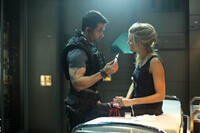 Guy Pearce as Snow and Maggie Grace as Emilie Warnock in "Lockout."