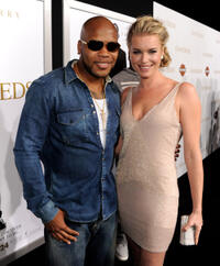 Rapper Flo Rida and Rebecca Romijn at the California premiere of "Tyler Perry's Good Deeds."