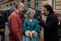 Director James McTeigue, Alice Eve and John Cusack on the set of "The Raven."