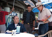 John Travolta, Taylor Kitsch and director Oliver Stone on the set of "Savages."