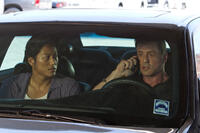 Kang Sung as Taylor Kwon and Sylvester Stallone as Jimmy in "Bullet To The Head."