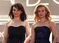 Juliet Binoche and Sarah Gadon at the premiere of "Cosmopolis" during the 65th Annual Cannes Film Festival in France.