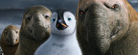 Mumble voiced by Elijah Wood and Bryan The Beachmaster voiced by Richard Carter in "Happy Feet Two."