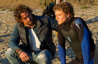 Gerard Butler as Frosty Hesson and Jonny Weston as Jay Moriarity in "Chasing Mavericks."