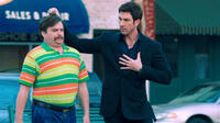 Zach Galifianakis as Marty Huggins and Dylan Mcdermott as Tim Wattley in "The Campaign."