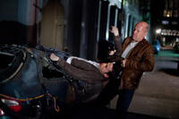 Joseph Gordon-Levitt as Joe and Bruce Willis as Joe in "Looper."