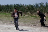 Joseph Gordon-Levitt as Joe and Noah Segan as Kid Blue in "Looper."