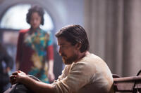 Ni Ni as Yu Mo and Christian Bale as John Miller in "The Flowers of War."