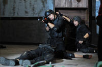 Joe Taslim as Jaka and R. Iman Aji as Eko in "The Raid."