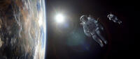 George Clooney as Matt Kowalski and Sandra Bullock as Ryan Stone in "Gravity."