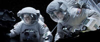 Sandra Bullock as Ryan Stone and George Clooney as Matt Kowalski in "Gravity."