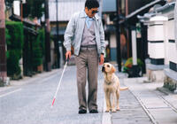 Kaoru Kobayashi as Mitsuru Watanabe and Quill in "Quill: The Life of a Guide Dog."