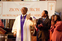 John Amos as Pastor Nelson and Romeo Miller as Jake in "Tyler Perry's Madea's Witness Protection."