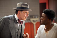 Harrison Ford as Branch Rickey and Chadwick Boseman as Jackie Robinson in "42."
