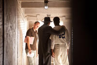 Director Brian Helgeland, Harrison Ford and Chadwick Boseman on the set of "42."
