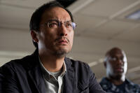 Ken Watanabe as Dr. Ishiro Serizawa and Richard T. Jones as Captain Russell Hampton in "Godzilla."