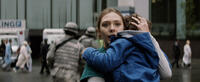 Elizabeth Olsen as Elle Brody and Carson Bolde as Sam Brody in "Godzilla."