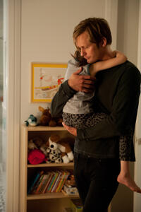 Onata Aprile as Maisie and Alexander Skarsgard as Lincoln in "What Maisie Knew."