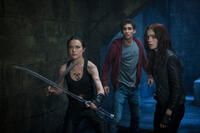 Jemima West as Isabelle Lightwood, Robert Sheehan as Simon Lewis and Lily Collins as Clary Fray in "The Mortal Instruments: City of Bones."