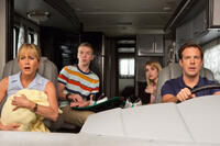 Jennifer Aniston as Rose O'Reilly, Will Poulter as Kenny Rossmore, Emma Roberts as Casey Mathis and Jason Sudeikis as David Clark in "We're the Millers."