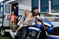 Jennifer Aniston as Rose O'Reilly, Jason Sudeikis as David Clark, Emma Roberts as Casey Mathis and Mark L. Young as Scottie P in "We're the Millers."