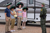 Jason Sudeikis as David Clark, Jennifer Aniston as Rose O'Reilly, Will Poulter as Kenny Rossmore, Emma Roberts as Casey Mathis and Kevin Dorff as Border Guard in "We're the Millers."