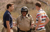 Jason Sudeikis as David Clark, Luis Guzman as Mexican Cop and Will Poulter as Kenny Rossmore in "We're the Millers."