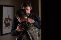 Dylan Minnette as Ralph Dover and Hugh Jackman as Keller Dover in "Prisoners."