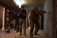 Josh Holloway as Neck, Arnold Schwarzenegger as Breacher, Max Martini as Pyro, and Kevin Vance as Tripod in "Sabotage."