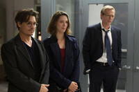 Johnny Depp as Will Caster, Rebecca Hall as Evelyn Caster and Paul Bettany as Max Waters in "Transcendence."