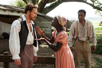Michael Fassbender as Edwin Epps, Lupita Nyong'o as Patsey and Chiwetel Ejiofor as Solomon Northup in "Twelve Years a Slave."