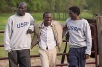 Ger Duany as Jeremiah, Arnold Oceng as Mamere and Emmanuel Jal as Paul in "The Good Lie."