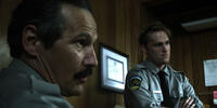 Nick Damici as Sheriff Meeks and Wyatt Russell as Deputy Anders in "We Are What We Are."