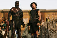 Adewele Akinnouye-Agbaje as Atticus and Kit Harington as Milo in "Pompeii."