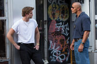 Liam Hemsworth as Chris Potamitis and Dwayne Johnson as James Ransome in "Empire State."