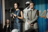 Jennifer Lawrence as Katniss Everdeen and Josh Hutcherson as Peeta Mellark in "The Hunger Games: Catching Fire."