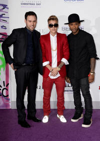 Producer Scooter Braun, Justin Bieber and producer Usher at the World premiere of "Justin Bieber's Believe."