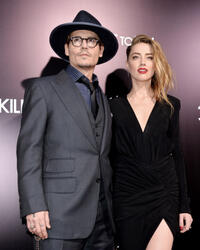 Johnny Depp and Amber Heard at the California premiere of "3 Days to Kill."