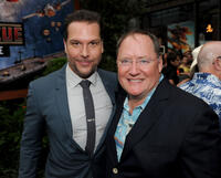 Dane Cook and executive producer John Lasseter at the California premiere of "Planes: Fire & Rescue."
