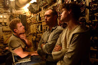 Branwell Donaghey as Gittens, Jude Law as Robinson and Bobby Schofield as Tobin in "Black Sea."