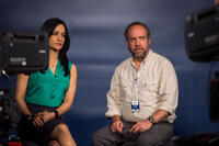 Archie Panjabi as Serena and Paul Giamatti as Lawrence in "San Andreas."
