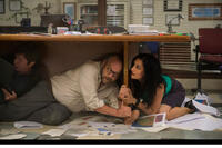 Paul Giamatti as Lawrence and Archie Panjabi as Serena in "San Andreas."